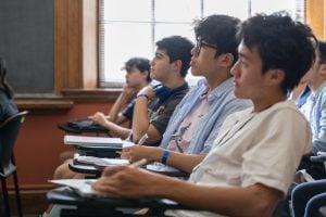 Students in class watching presentation.