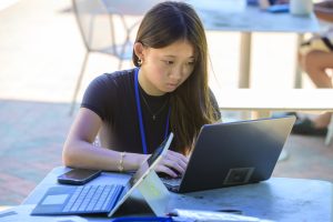 Student working on laptop.